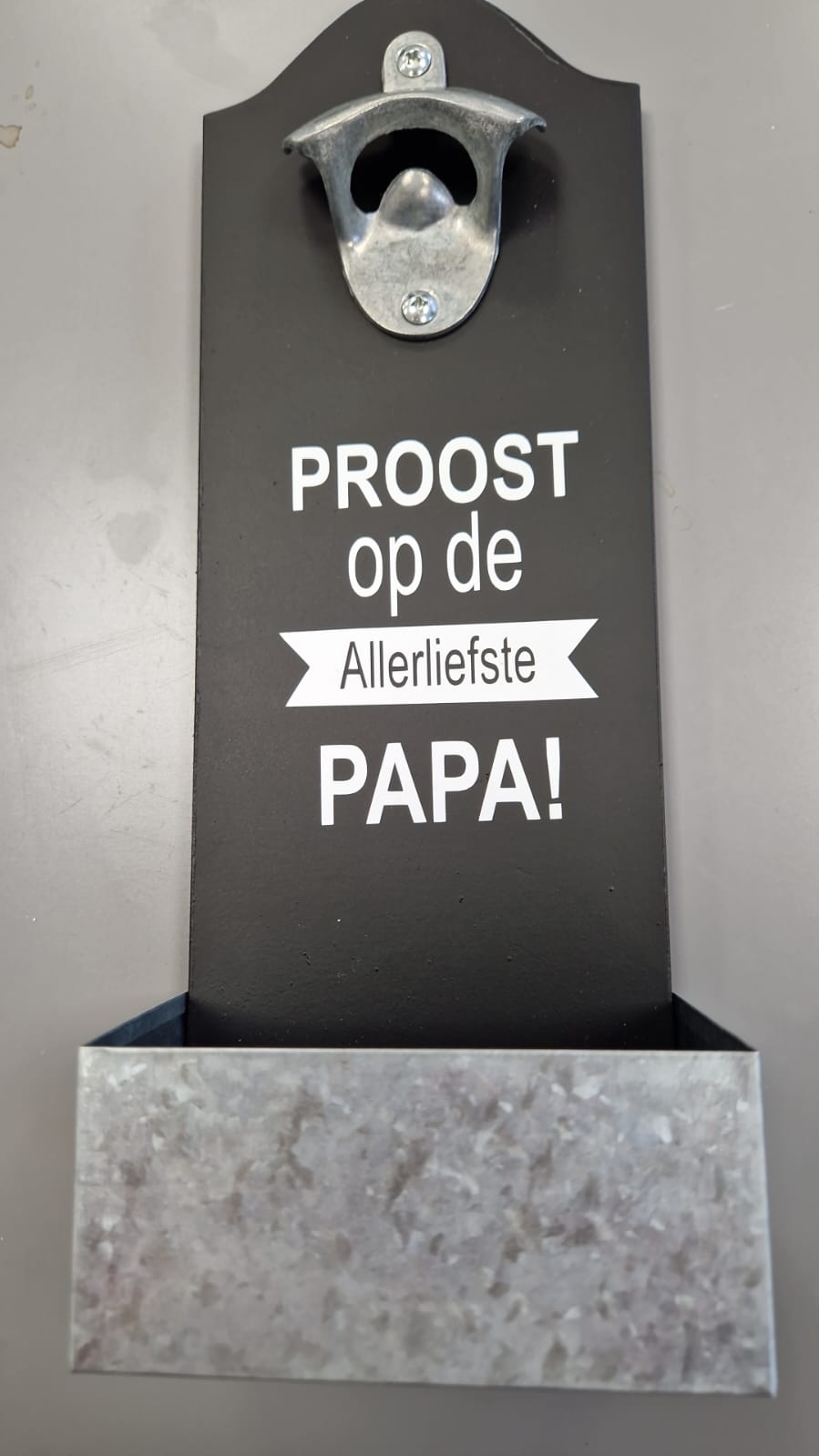 Opener met opvangbakje
